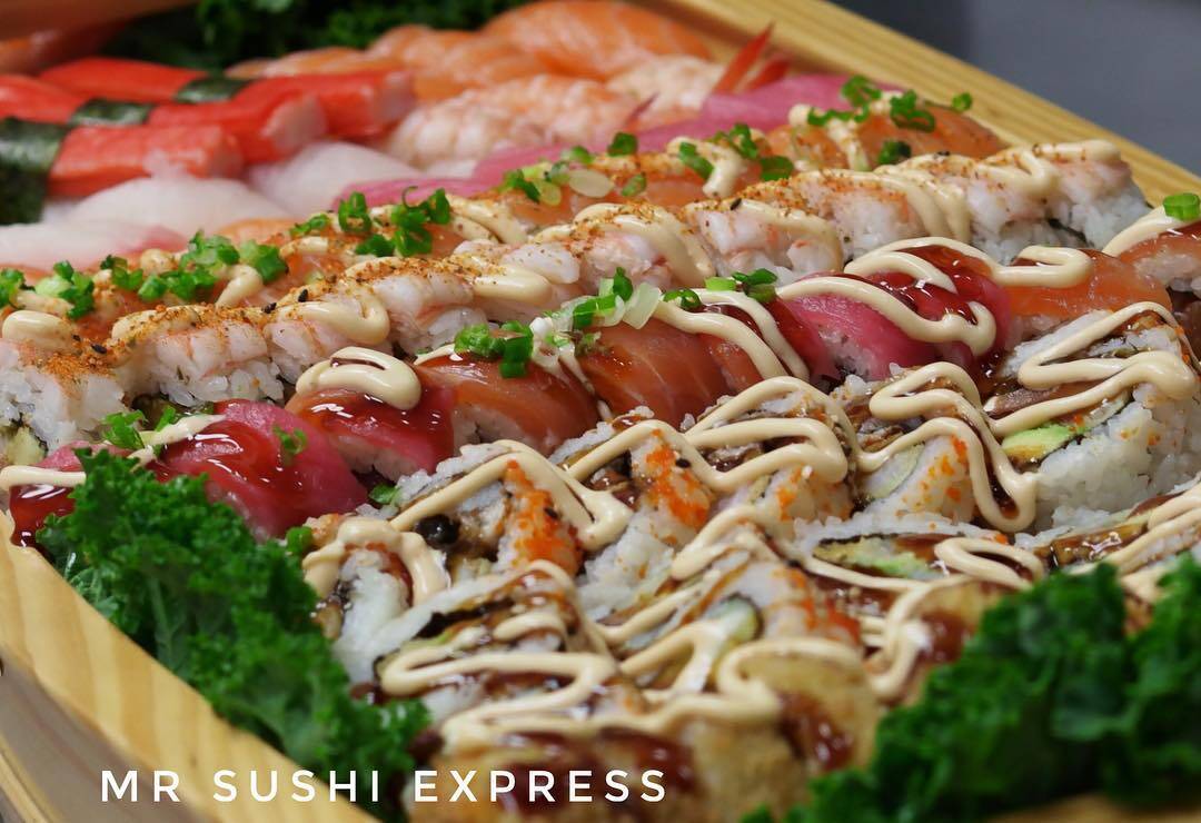 Sushi rolls presented in a wooden serving boat
