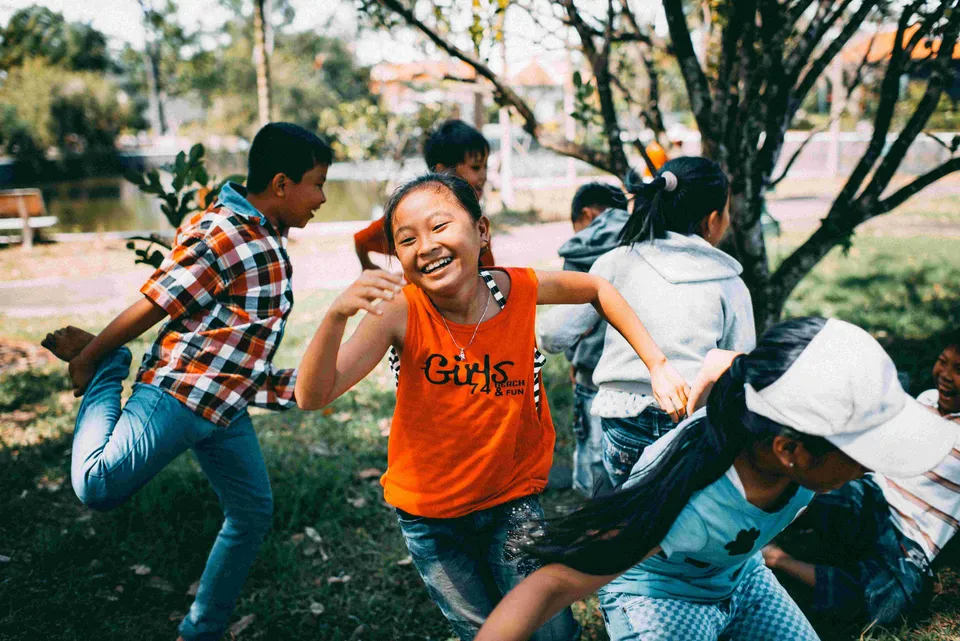Children running outside together
